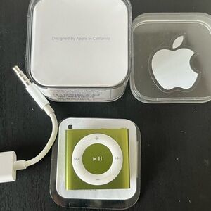 Apple iPod shuffle.  2GB. Comes with charger and original box and information.